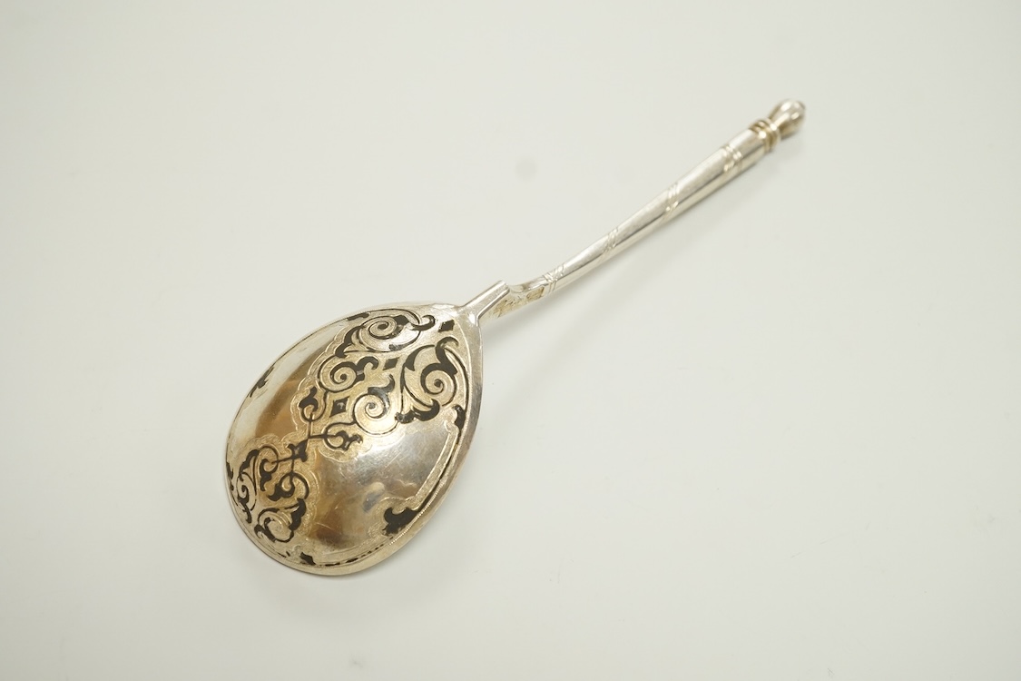 A mid 19th century Russian 84 zolotnik and niello spoon, assay master probably I. Avdyeyev, Moscow, 1857, 18cm.